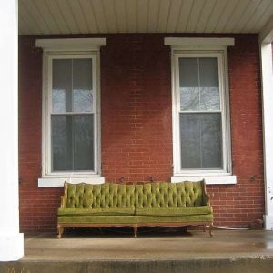 Green Couch on Brick Porch Phoenixville PA Green Couch on Brick Porch Phoenixville PA